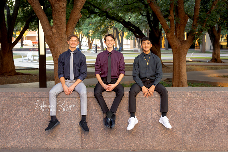 High school senior posing for Homecoming pictures at Burnett Park in Fort Worth.