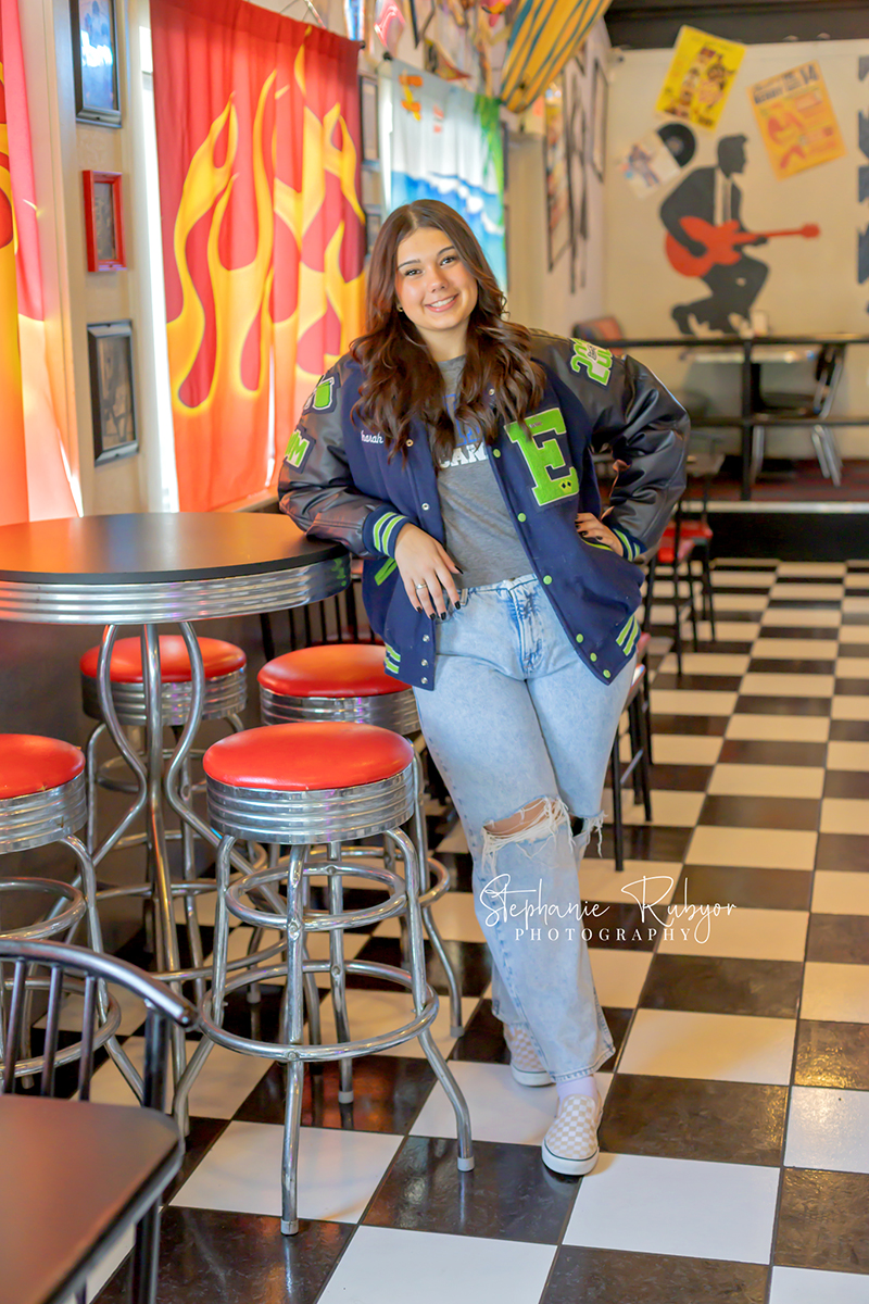 Senior girl posing for senior photo shoot at Yesterdays 50s Diner in Decatur, Texas. 