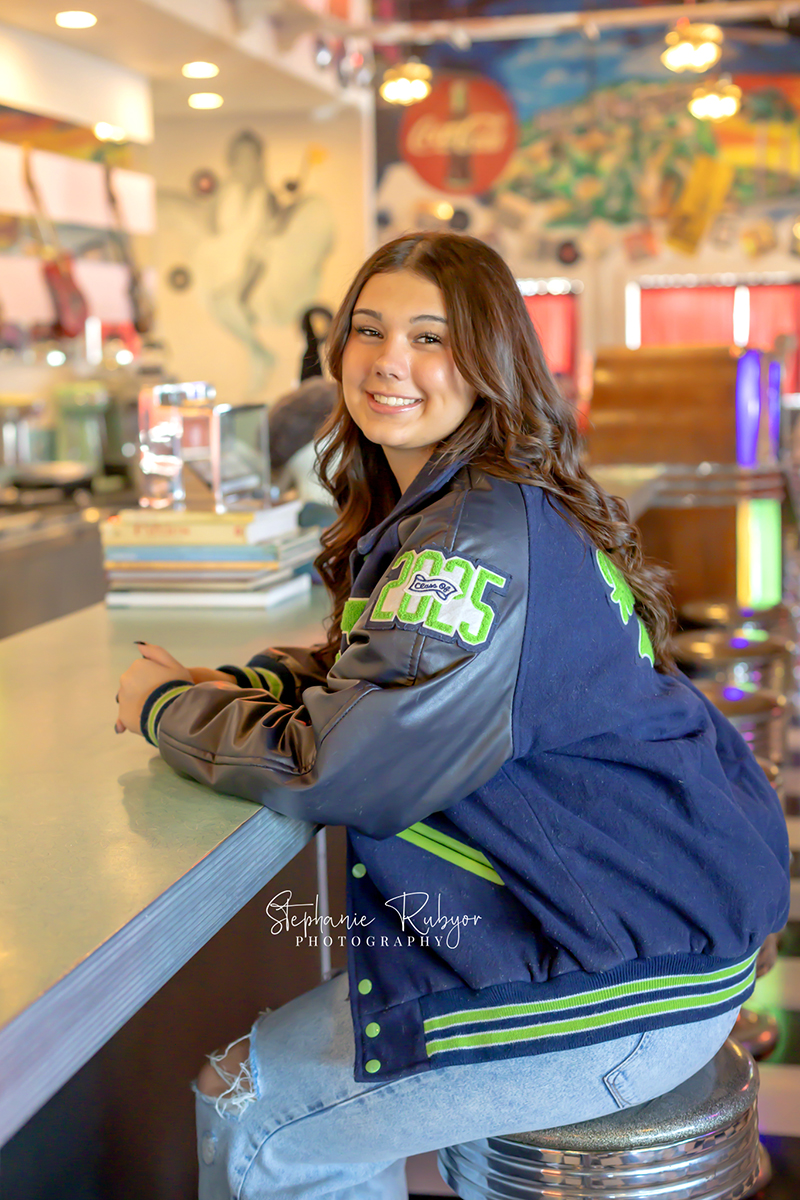 Senior girl posing for senior photo shoot at Yesterdays 50s Diner in Decatur, Texas. 