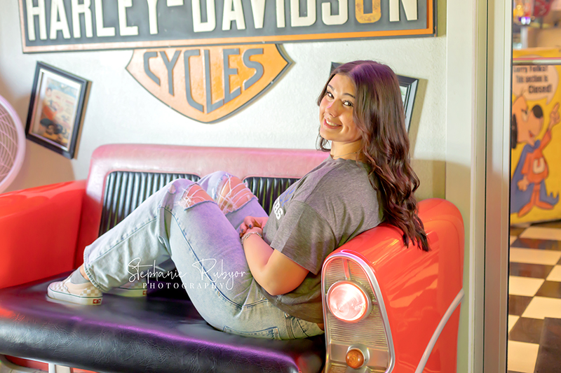 Senior girl posing for senior photo shoot at Yesterdays 50s Diner in Decatur, Texas. 